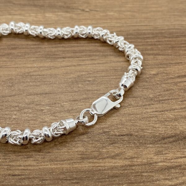 Silver Byzantine bracelet with clasp.