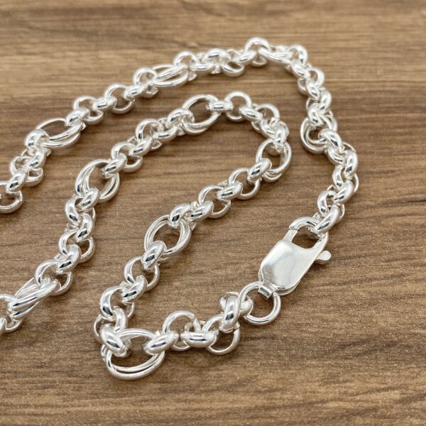 Silver chain link bracelet with clasp.