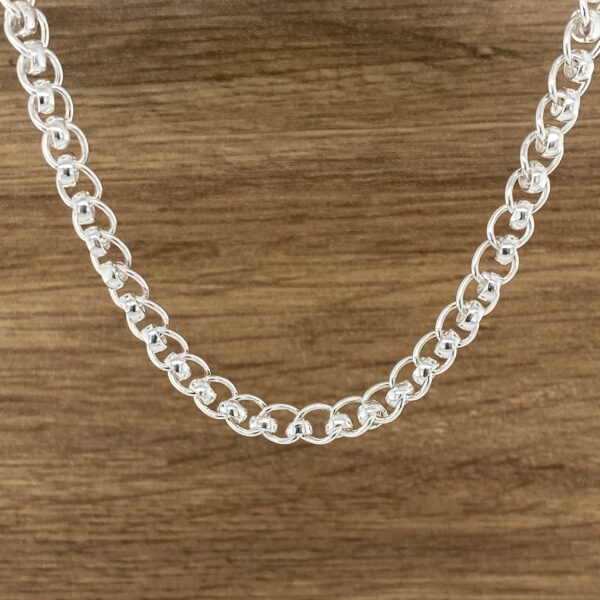 Silver beaded chain necklace.