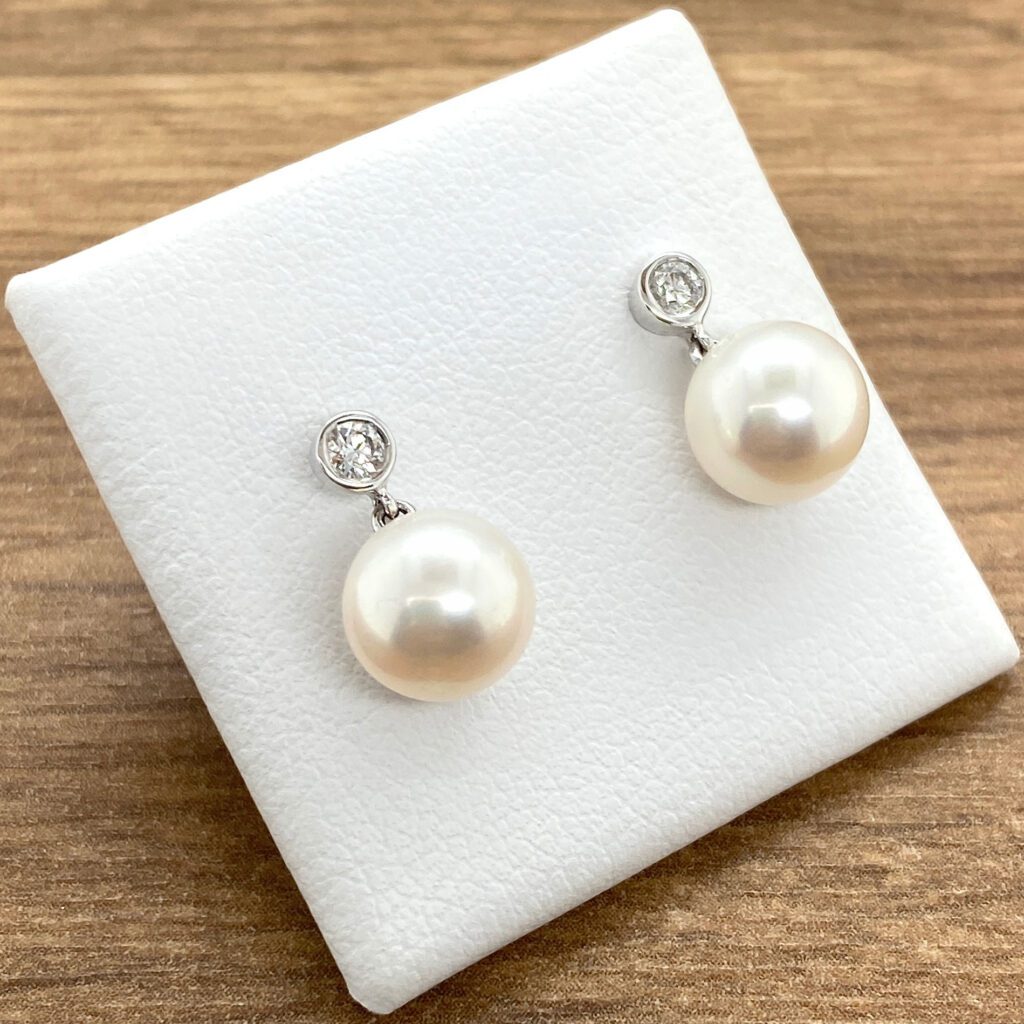Elegant pearl and diamond earrings.