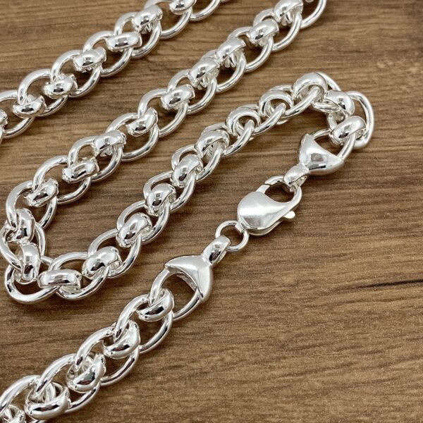Silver curb chain necklace with clasp.