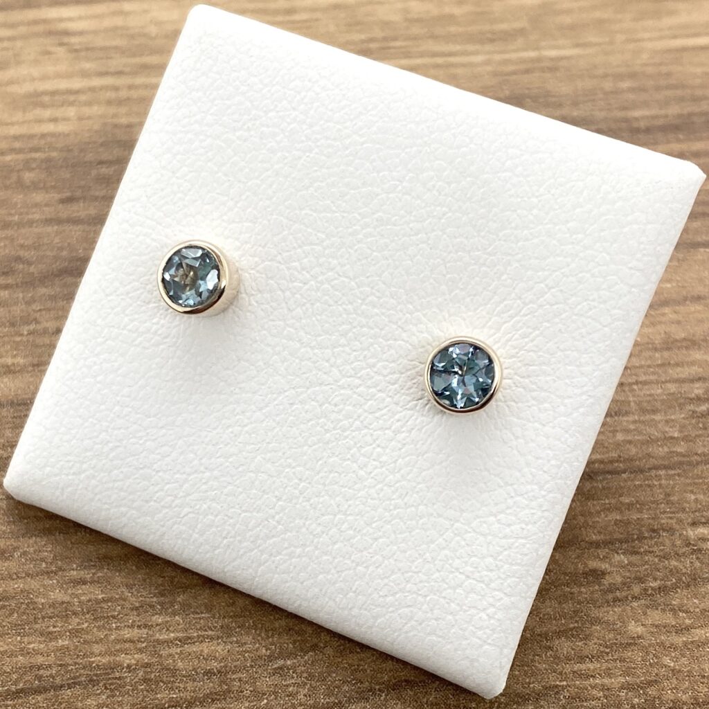 Blue topaz stud earrings in silver.