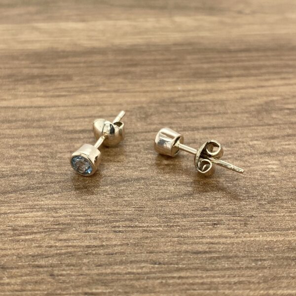 Silver blue gemstone stud earrings.