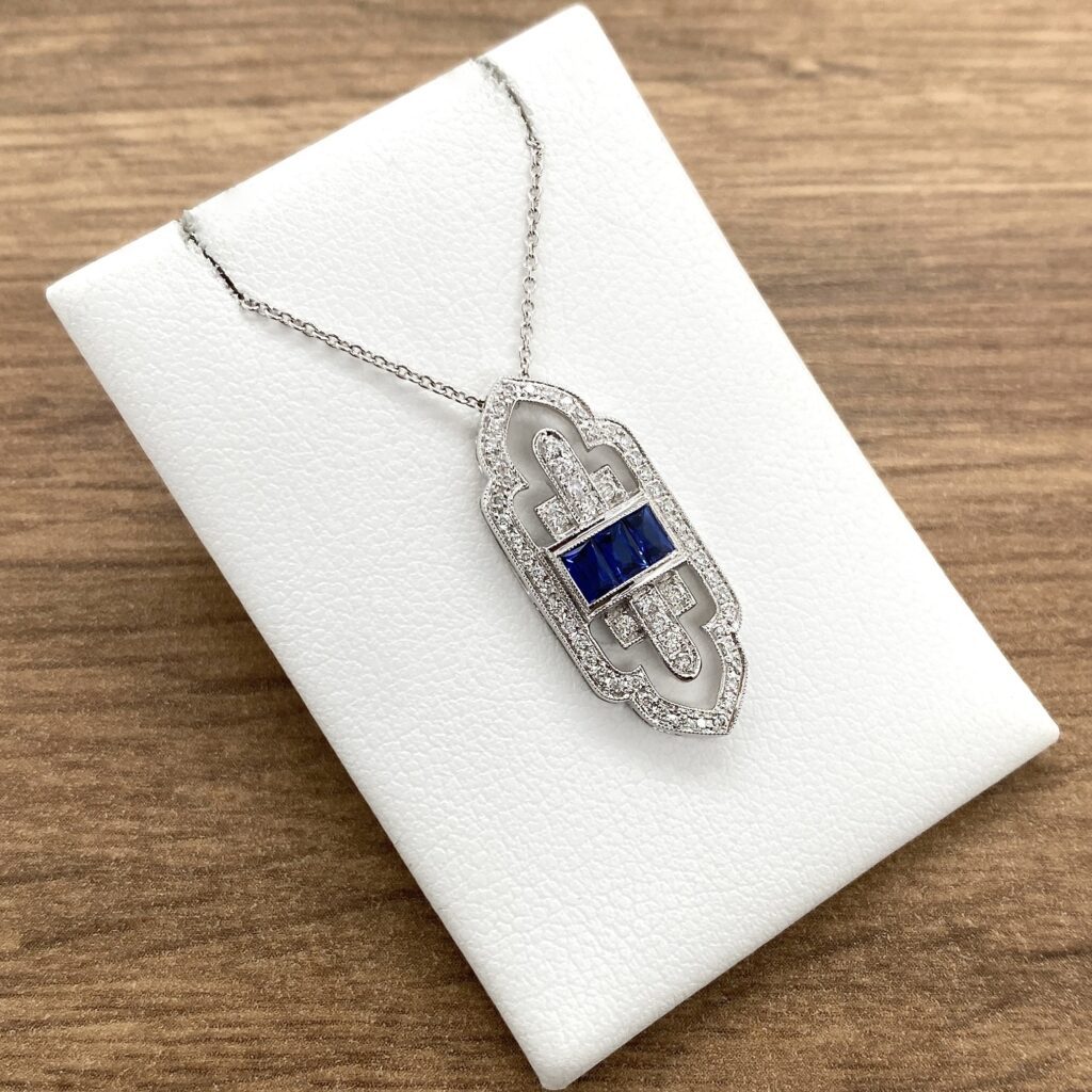 Elegant sapphire and diamond pendant necklace.