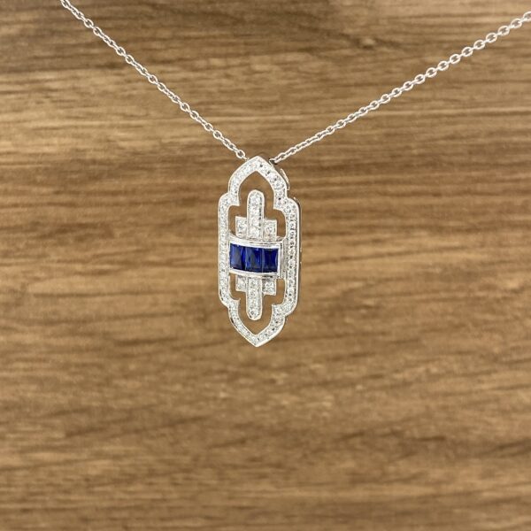 Diamond and sapphire pendant necklace.