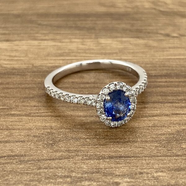 Diamond halo sapphire engagement ring.