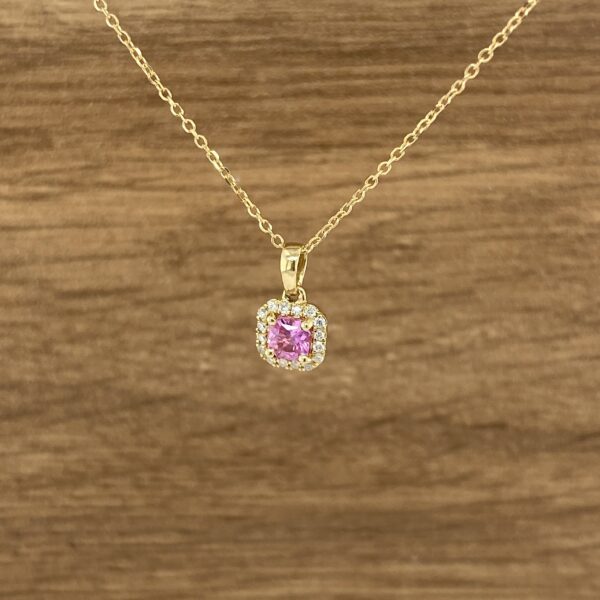 Pink sapphire and diamond pendant necklace.