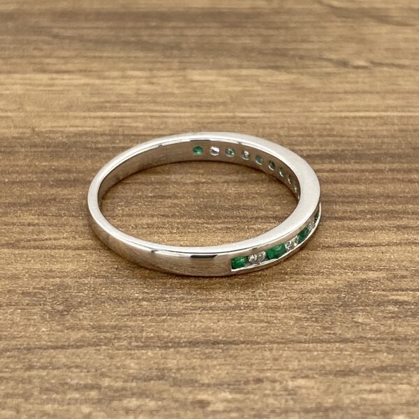 Emerald and diamond eternity band.