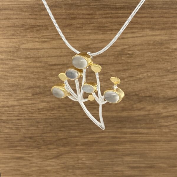 Silver and gold moonstone flower necklace.