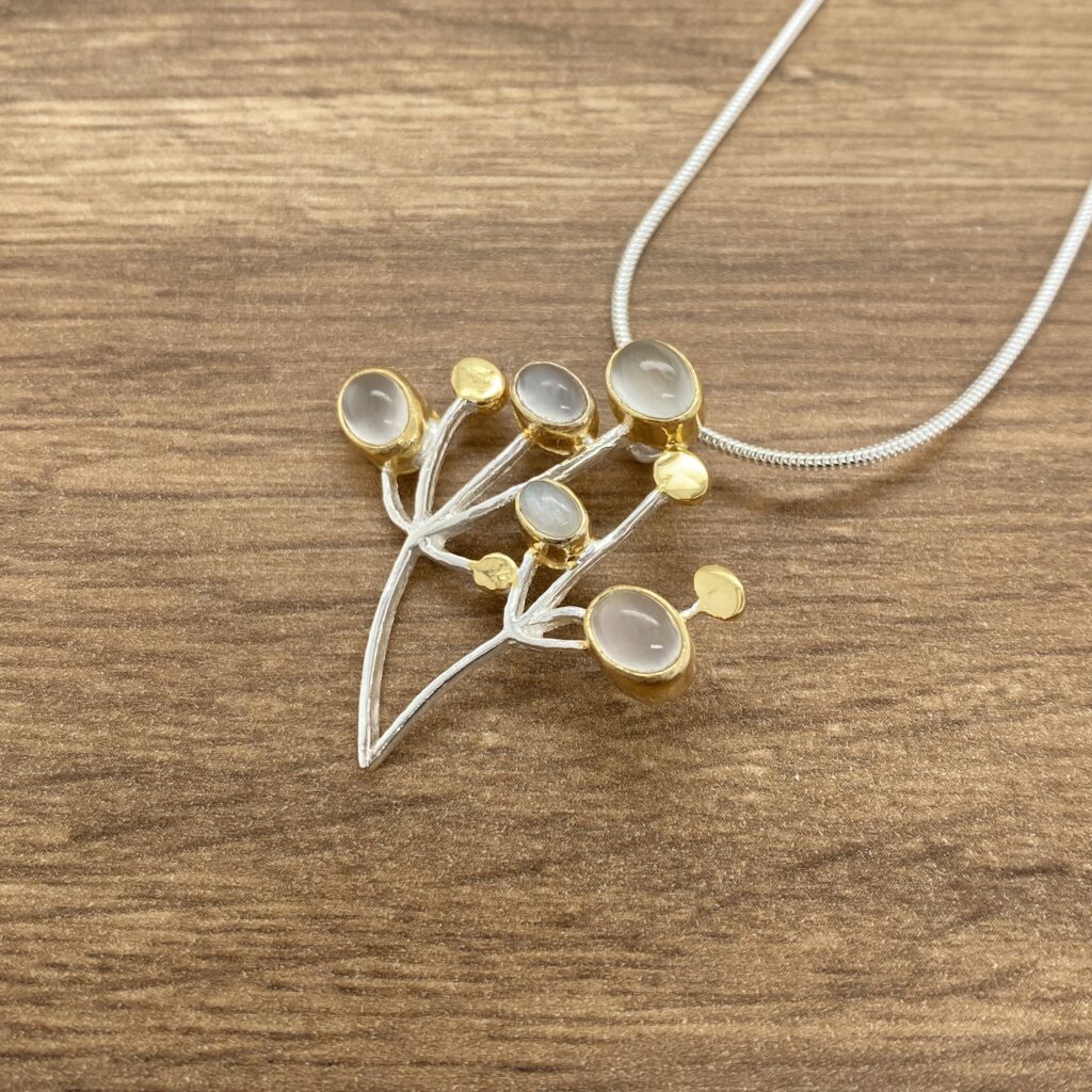 Silver and gold moonstone branch necklace.