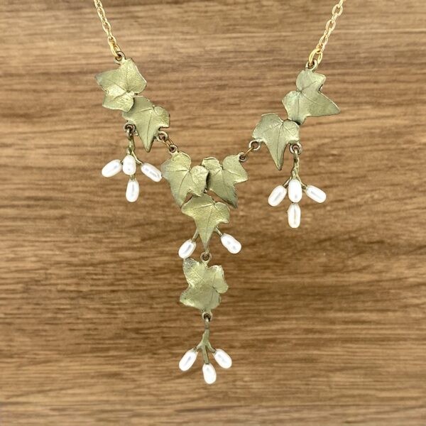 Gold ivy leaf necklace with pearls.