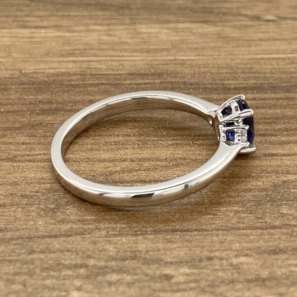 White gold sapphire three-stone ring.