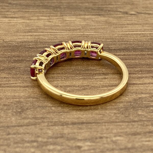 Gold ruby ring with five stones.
