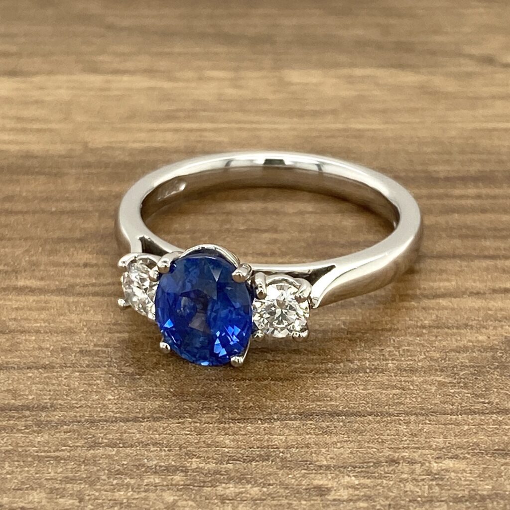 Three-stone sapphire and diamond ring.