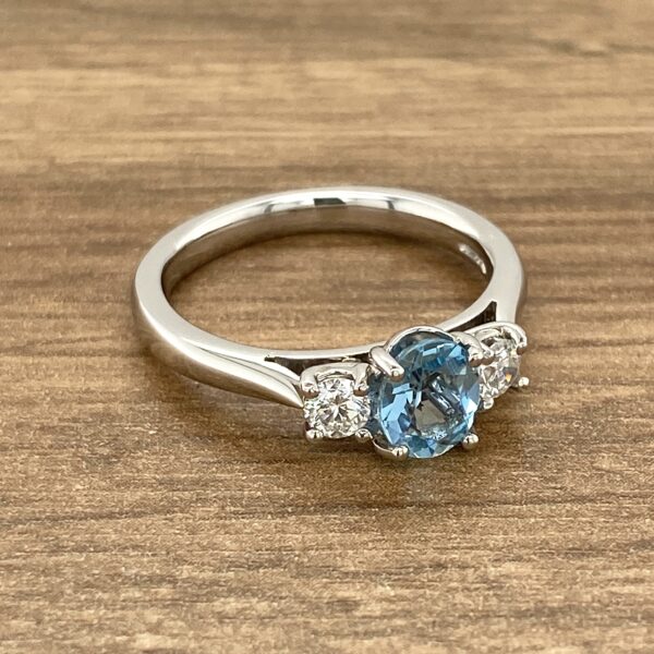 Aquamarine and diamond three-stone ring.