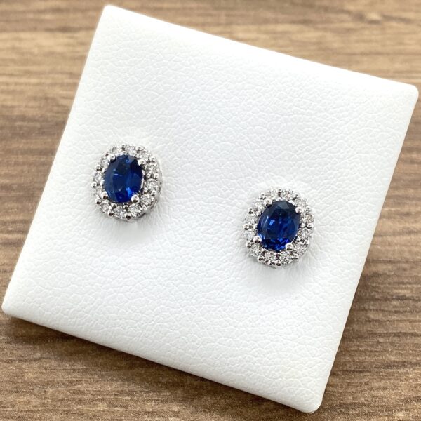 Oval sapphire and diamond stud earrings.