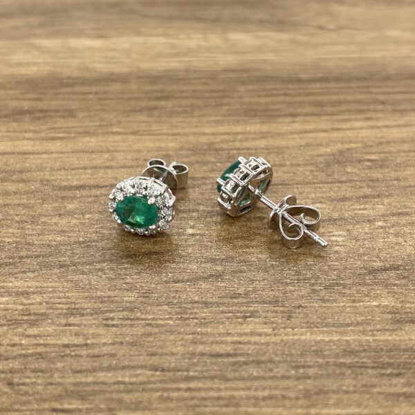 Emerald and diamond stud earrings.