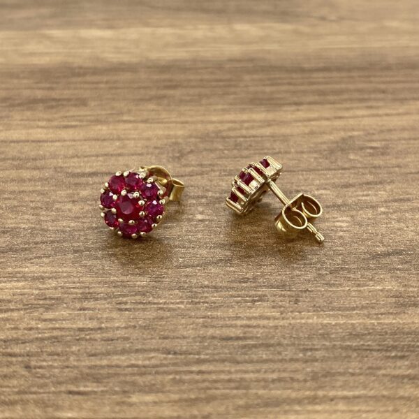 Gold ruby cluster stud earrings.